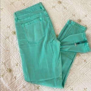 Mint green skinny jeans zipper hem